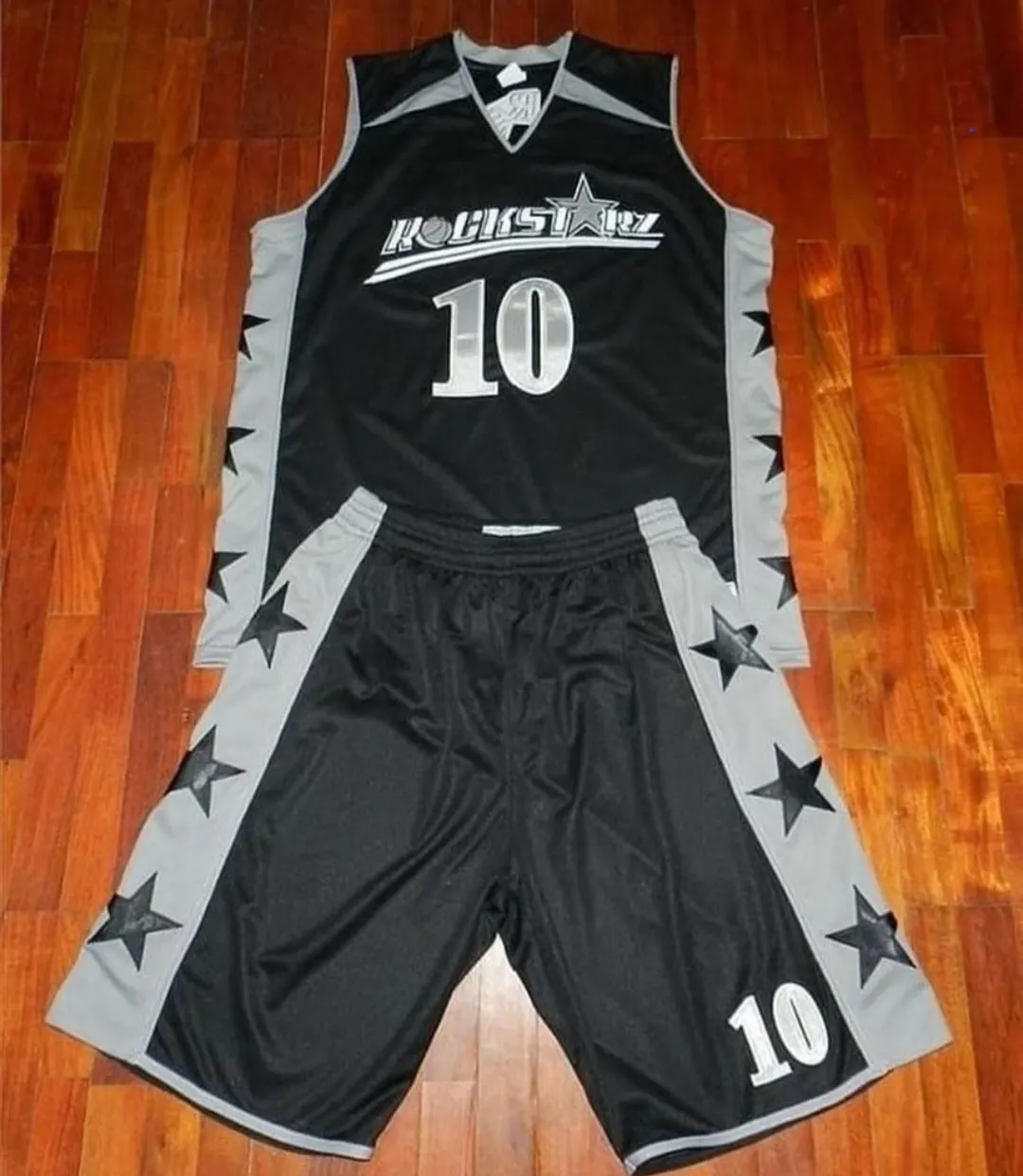 Custom black and grey basketball uniform made by Ravix Pro Industry clothing manufacturer in Sialkot, Pakistan