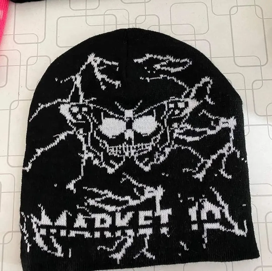 Custom black jacquard knitted beanie with skull design made by Ravix Pro Industry clothing manufacturer in Sialkot, Pakistan